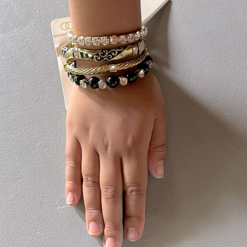 FOUR BRACELETS: 2 PAIRS ARE NEW : 2 USED
